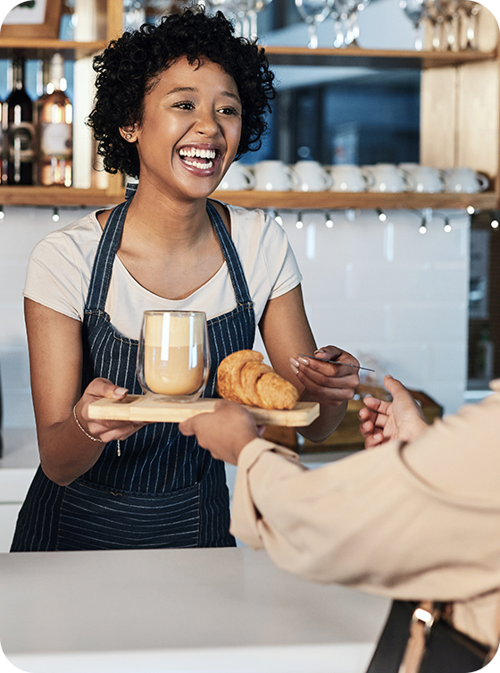 Coffee shop serving a customer's drink